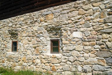 farm house in Bavaria with many details from the roof to wooden windows and doors