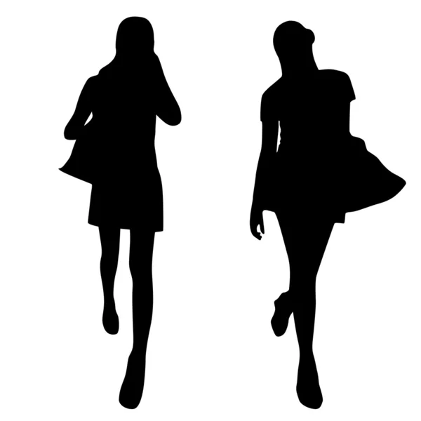 Silhouettes of fashion women — Stock Vector