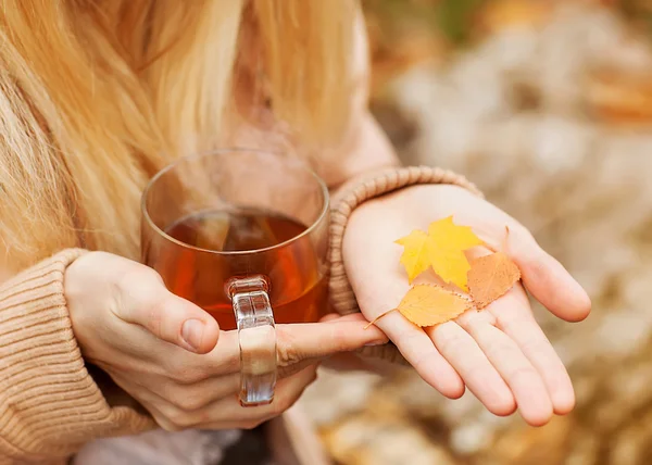 Female hands with hot drink, on light background — Stock Photo, Image