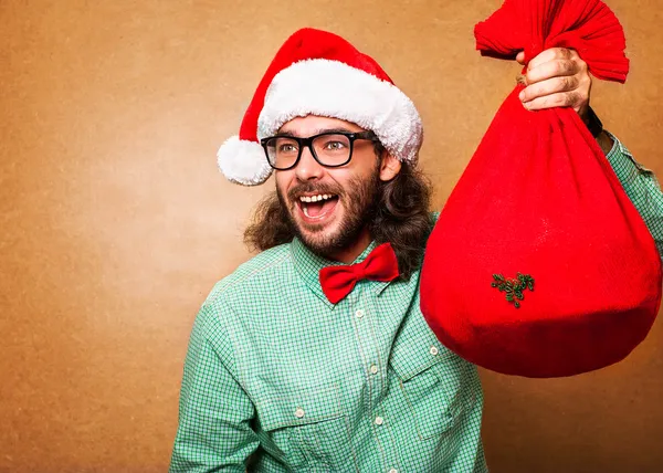 Papai Noel correndo com o saco dos presentes — Fotografia de Stock