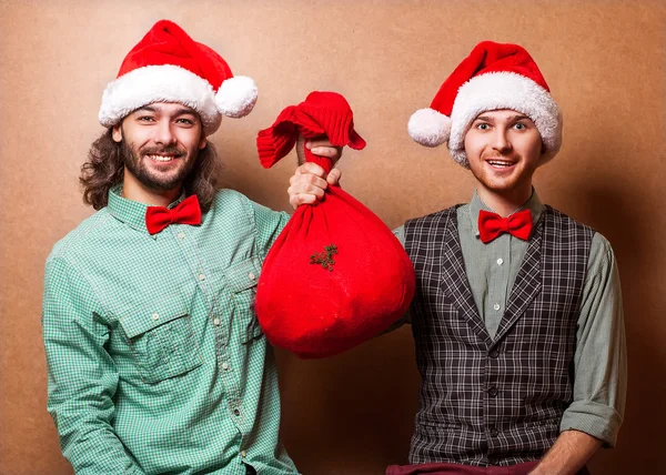 Jultomte med påsen med presenter — Stockfoto