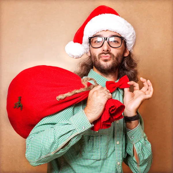 Kerstman met een zak met geschenken — Stockfoto