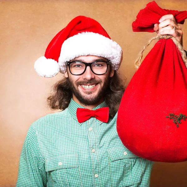 Kerstman met een zak met geschenken — Stockfoto