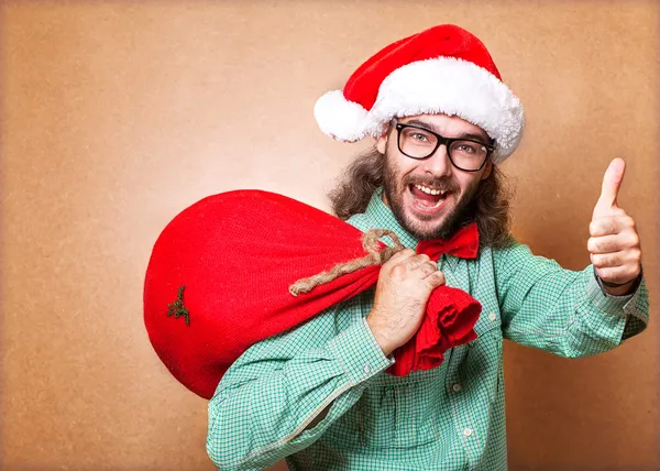 Hipster Santa Claus con la bolsa de los regalos muestra fresco — Foto de Stock