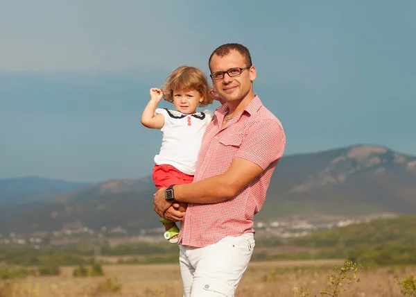 Father and daughter walking on the mountains — Stock Photo, Image