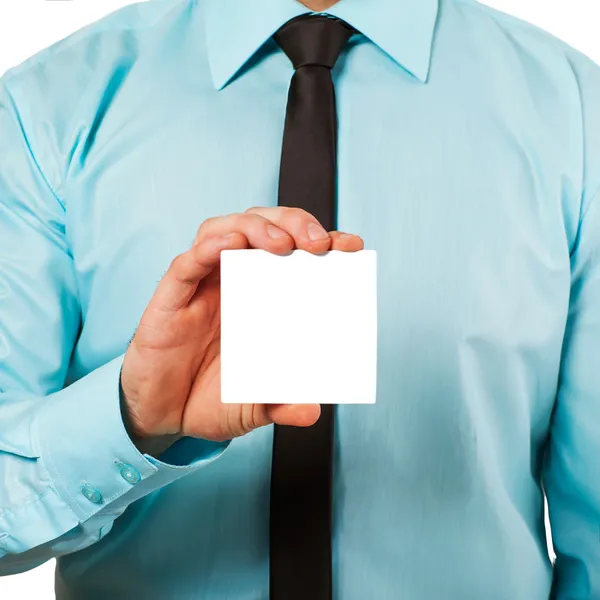 Man's hand showing business card - closeup shot on white backgro