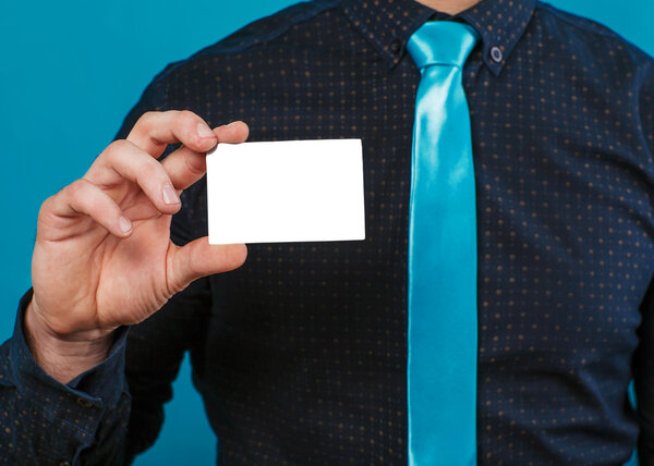 Part of body of business man who takes out business card from the pocket