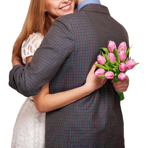 Young couple in love holding a bouquet of tulips. The concept of — Stock Photo, Image