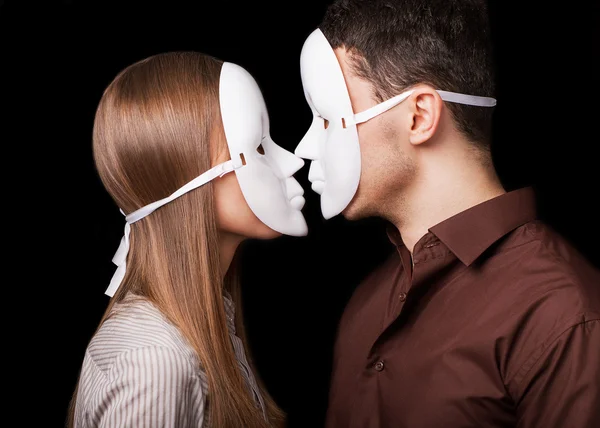 Fashion Happy Couple in Love holding a white mask face. Psycholo — Stock Photo, Image