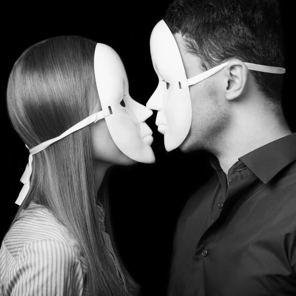 Fashion Happy Couple in Love holding a white mask face. Psycholo — Stock Photo, Image