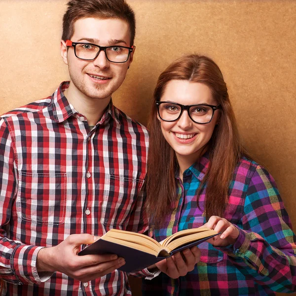 Couple of guys dressed in clothes hipsters are in the studio Royalty Free Stock Photos