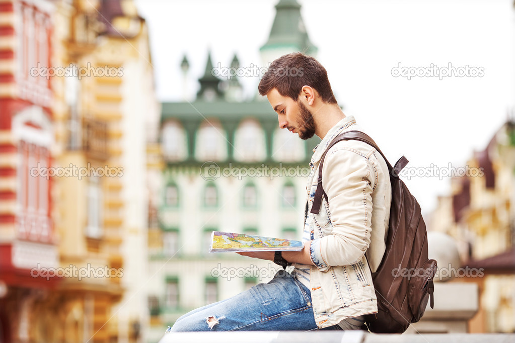 Tourist with map in the city
