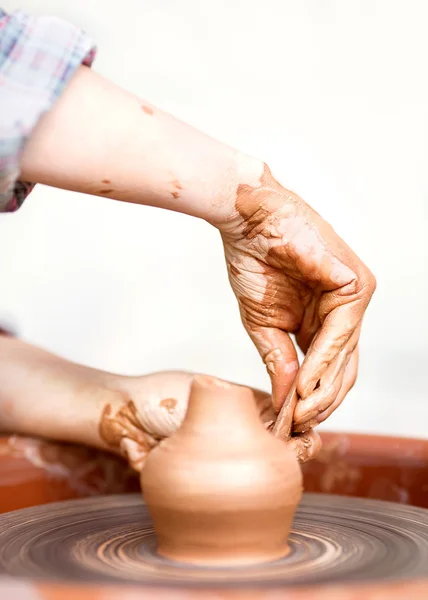 Hands working on pottery wheel , retro style toned — Stock Photo, Image