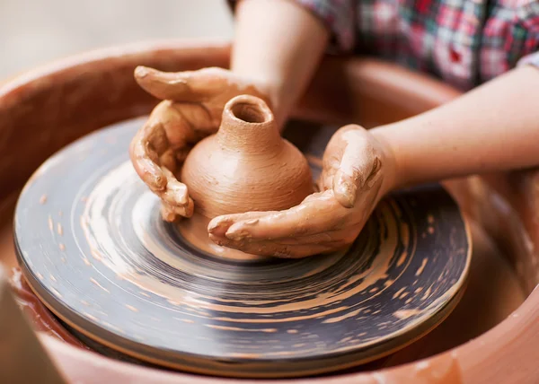 Hands working on pottery wheel — Stock Photo, Image