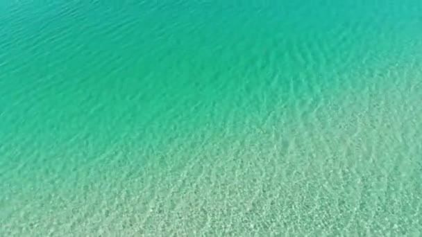 Aerial top view of turquoise water surface. Aerial view. Marine video background — Stock Video