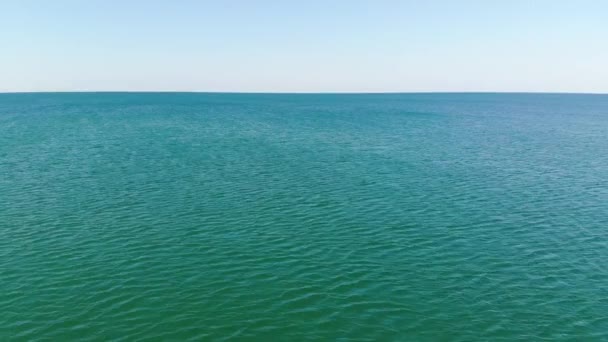 Aerial top view of turquoise water surface. Aerial view. Marine video background — Stock Video