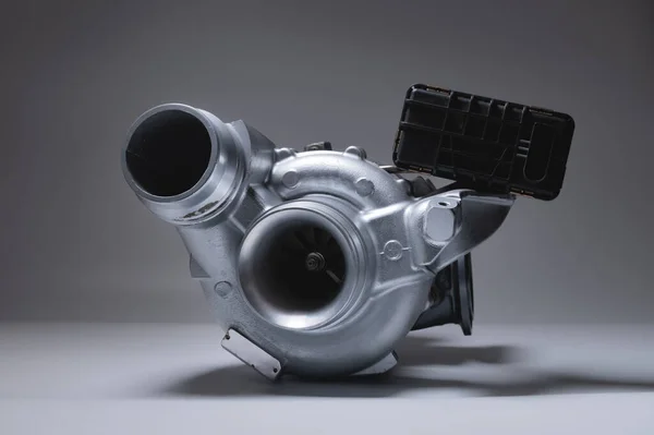 New metal turbocharger. Exhaust gas blower. Parts background — Stock Photo, Image