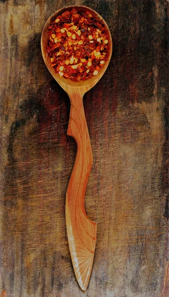 Wooden spoon with dry pepper Stock Photo