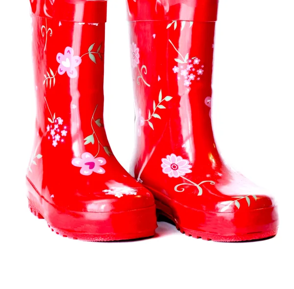 Un par de botas de goma rojo brillante — Foto de Stock