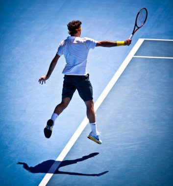 Melbourne - 25 Ocak: Roger Federer İsviçre Stanislas Wawrinka İsviçre 2011 Avustralya Açık'in üzerinde onun çeyrek final kazanmak içinde