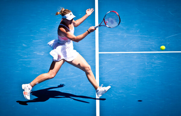 MELBOURNE - JANUARY 23: Caroline Wozniacki of Denmark in her fourth round win over Anastasija Sevastova of Latvia in the 2011 Australian Open