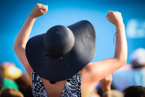 Woman in hat cheering — Stock Photo, Image