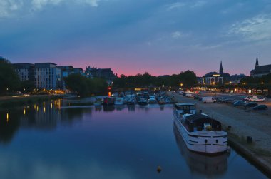 Nantes, France - May 2, 2022:. Boats and yachts on the Erdre river dock in Nantes city at twilight .