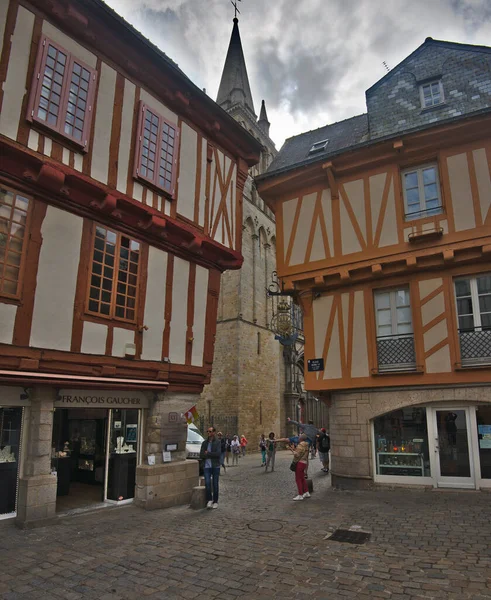 Vannes, France - May 25, 2022: Colorful old wooden houses and St. Peter\'s Basilica in the historical center of Vannes, coastal medieveal town in Morbihan departement, Brittany, France