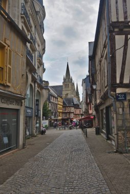 Vannes, France - May 25, 2022: Colorful old wooden houses and St. Peter\'s Basilica in the historical center of Vannes, coastal medieveal town in Morbihan departement, Brittany, France