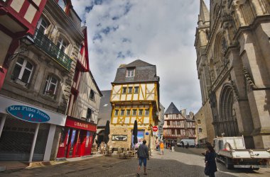 Vannes, France - May 25, 2022: Colorful old wooden houses and St. Peter\'s Basilica in the historical center of Vannes, coastal medieveal town in Morbihan departement, Brittany, France