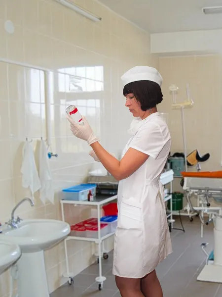 Medical sister collects medications for to manipulation — Stock Image Medical sister collects medications for to manipulation Stock Picture