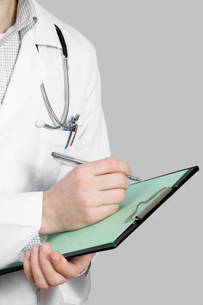 Doctor with stethoscope and clipboard — Stock Photo, Image