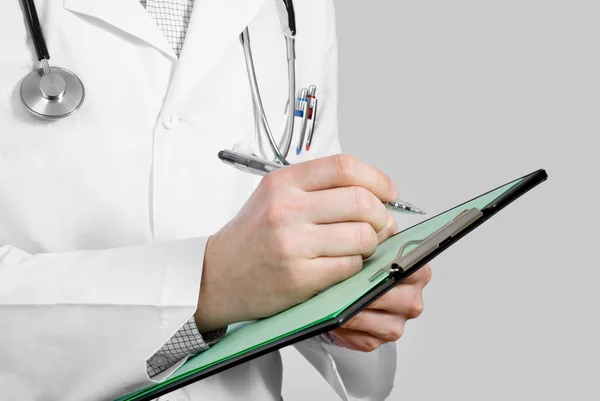 Doctor with stethoscope and clipboard — Stock Photo, Image