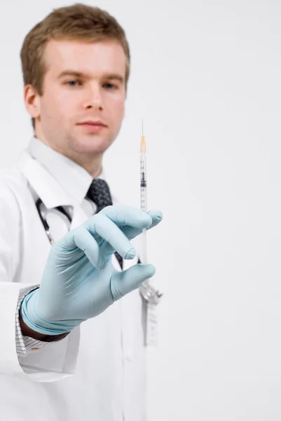 Professional doctor with medical syringe in hands — Stock Photo, Image