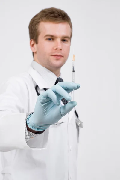 Professional doctor with medical syringe in hands — Stock Photo, Image