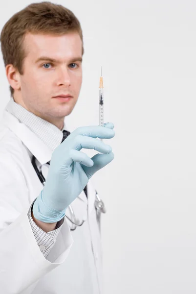 Doctor with medical syringe in hand ready to make injection — Stock Photo, Image