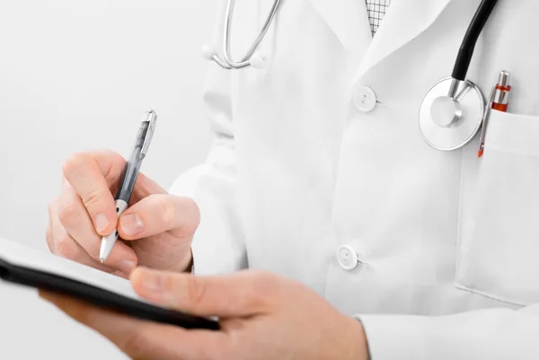 Doctor with stethoscope and clipboard — Stock Photo, Image