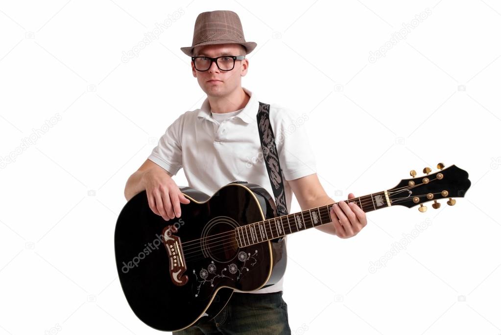 Musician in fedora with guitar.