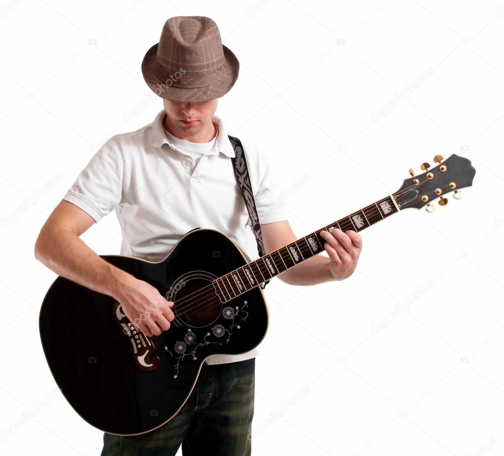 Young musician playing solo on guitar.