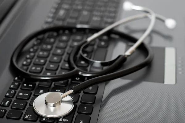Computer with stethoscope on it — Stock Photo, Image