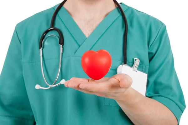 Doutor com coração vermelho nas mãos — Fotografia de Stock