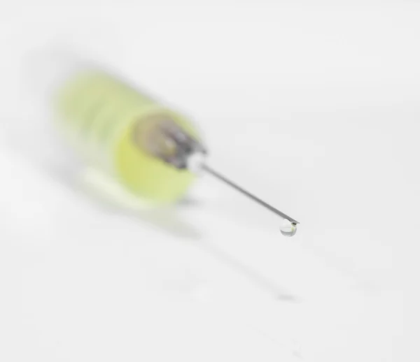 Close-up of syringe with needle drop — Stock Photo, Image