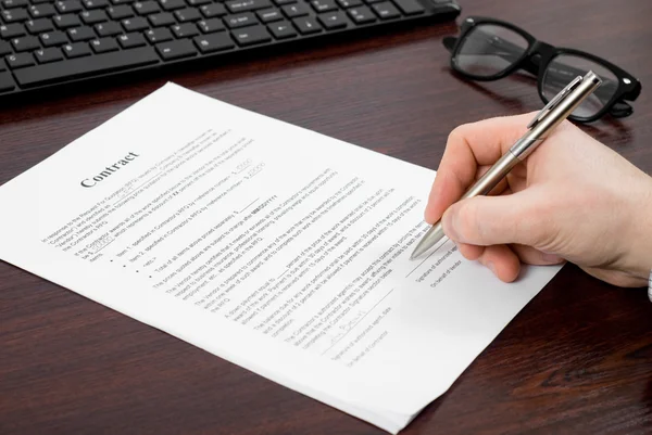 Businessman  signing papers Stock Picture