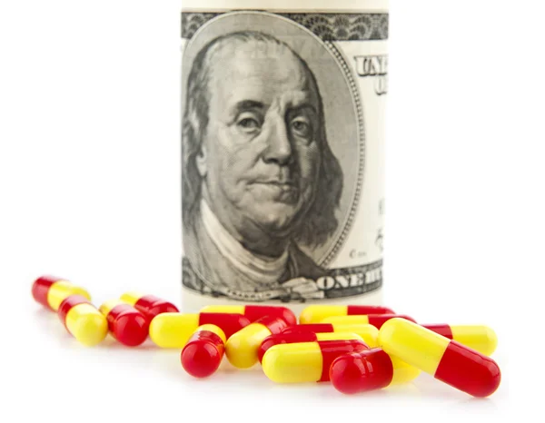 Pills and dollars — Stock Photo, Image