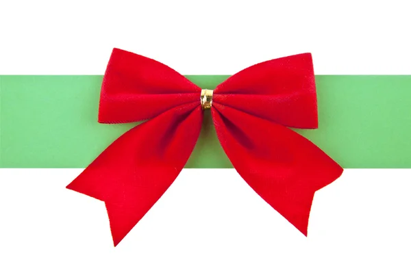 Red bow with a green ribbon — Stock Photo, Image