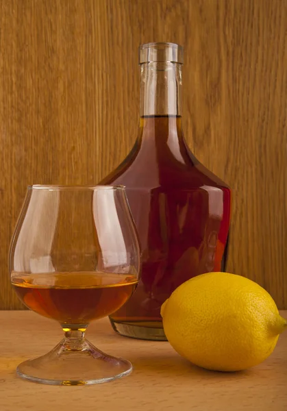 Cognac and lemon — Stock Photo, Image