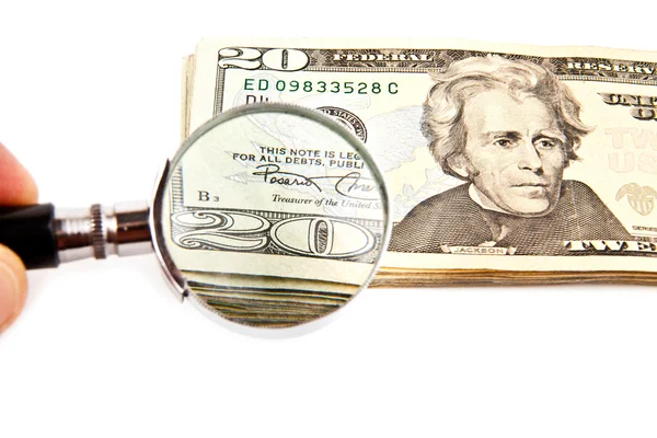 Dollars and magnifying glass — Stock Photo, Image