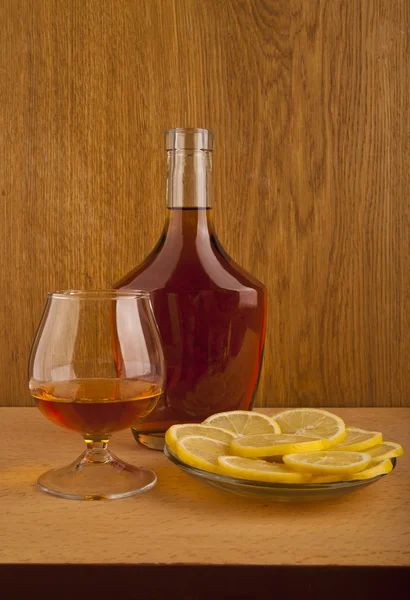 Cognac and lemon — Stock Photo, Image