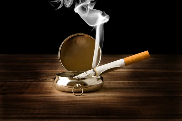 Ash-tray with a cigarette — Stock Photo, Image