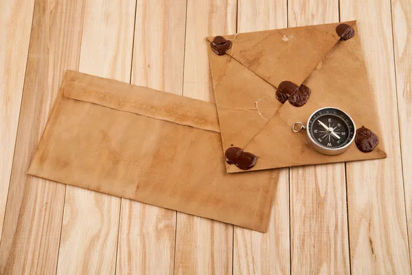 Old envelopes and compass — Stock Photo, Image